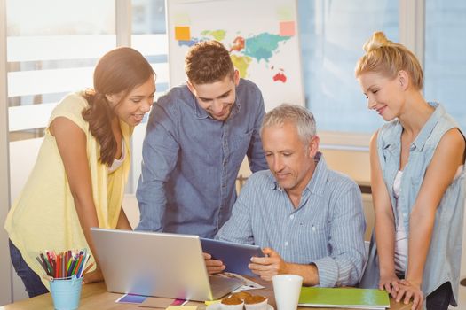 Business people using technologies in meeting room at creative office