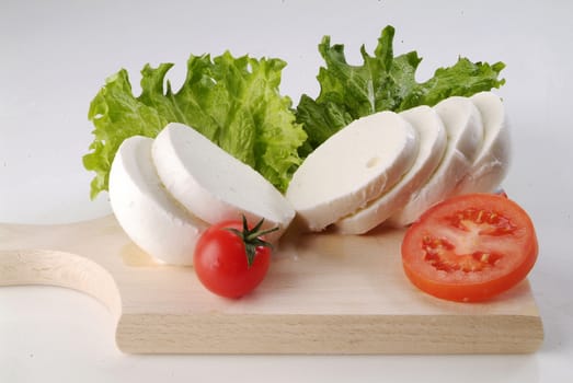 Italian salad with slices of mozzarella and tomatoes