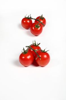 six cherry tomatoes on white