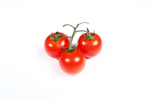 three cherry tomatoes on white background