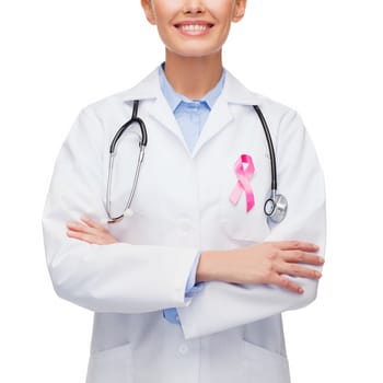 healthcare and medicine concept - female doctor with pink breast cancer awareness ribbon