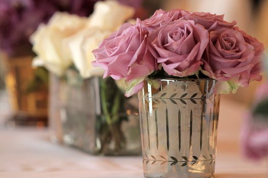 Bouquet of rose flowers in glass vase