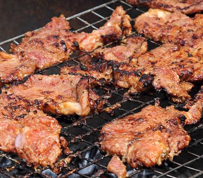 Grilled barbecue pork on the grill