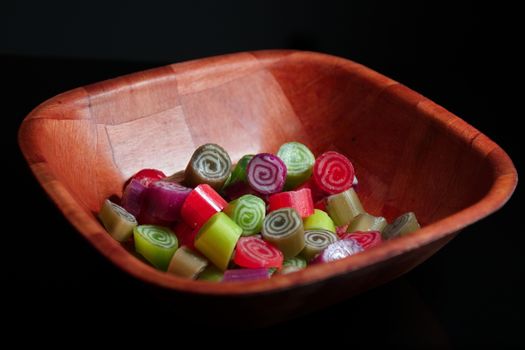 Colorful candies on black background