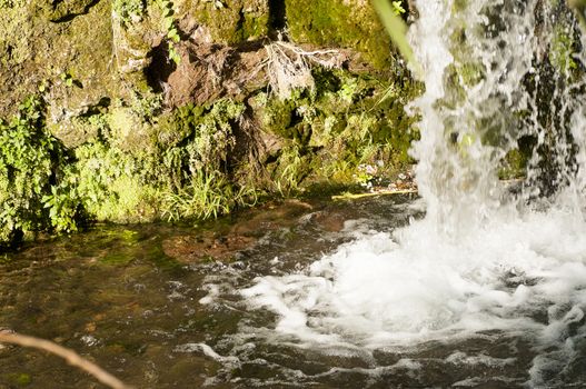 Details of waterfalls in a park in summer