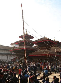 NEPAL, Kathmandu:  	The erection of a wooden Indradhoj pole in Hanumandhoka�Durbar Square on September 25, 2015 marked the beginning of Indrajatra festival in Kathmandu, Nepal.  	Indrajatra is an eight day festival with a chariot procession dedicated to Goddess Kumari, Lord Ganesh and Bhairav, as well as worshiping Indra, the king of gods. 