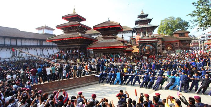 NEPAL, Kathmandu:  	The erection of a wooden Indradhoj pole in Hanumandhoka�Durbar Square on September 25, 2015 marked the beginning of Indrajatra festival in Kathmandu, Nepal.  	Indrajatra is an eight day festival with a chariot procession dedicated to Goddess Kumari, Lord Ganesh and Bhairav, as well as worshiping Indra, the king of gods. 