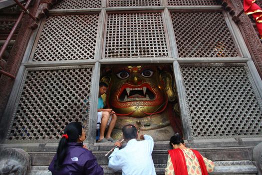 NEPAL, Kathmandu:  	The erection of a wooden Indradhoj pole in Hanumandhoka�Durbar Square on September 25, 2015 marked the beginning of Indrajatra festival in Kathmandu, Nepal.  	Indrajatra is an eight day festival with a chariot procession dedicated to Goddess Kumari, Lord Ganesh and Bhairav, as well as worshiping Indra, the king of gods. 