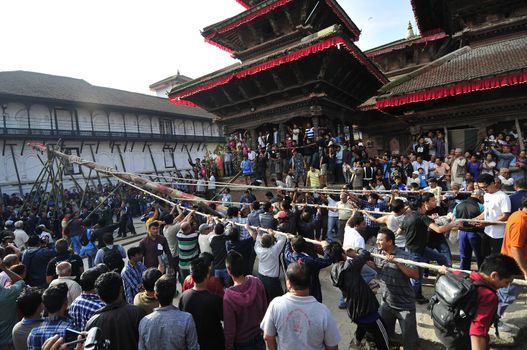 NEPAL, Kathmandu: 	The erection of a wooden�Indradhoj�pole in�Hanumandhoka�Durbar�Square on September 25, 2015 marked the beginning of�Indra�Jatra�festival in Kathmandu, Nepal.  	Indra�Jatra�is an eight day festival with a chariot procession dedicated to Goddess�Kumari, Lord�Ganesh�and�Bhairav, as well as worshiping�Indra, the king of gods. 