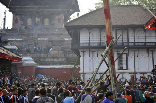 NEPAL, Kathmandu: 	The erection of a wooden�Indradhoj�pole in�Hanumandhoka�Durbar�Square on September 25, 2015 marked the beginning of�Indra�Jatra�festival in Kathmandu, Nepal.  	Indra�Jatra�is an eight day festival with a chariot procession dedicated to Goddess�Kumari, Lord�Ganesh�and�Bhairav, as well as worshiping�Indra, the king of gods. 