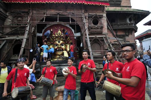 NEPAL, Kathmandu: 	The erection of a wooden�Indradhoj�pole in�Hanumandhoka�Durbar�Square on September 25, 2015 marked the beginning of�Indra�Jatra�festival in Kathmandu, Nepal.  	Indra�Jatra�is an eight day festival with a chariot procession dedicated to Goddess�Kumari, Lord�Ganesh�and�Bhairav, as well as worshiping�Indra, the king of gods. 