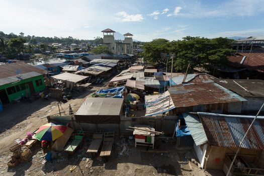 poor houses with sheet tin by the river, Kota Manado, North Sulawesi, Indonesia