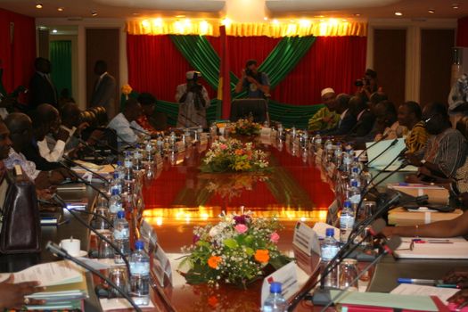 BURKINA FASO, Ouagadougou : Burkina Faso's interim president Michel Kafando and prime minister Isaac Zida take part in the first post-coup cabinet meeting, on September 25, 2015 in Ouagadougou. People rejoiced in Burkina Faso's capital on the eve, two days after the military restored power to a civilian regime, but uncertainty hung over the fate of the elite presidential guard that staged last week's coup.