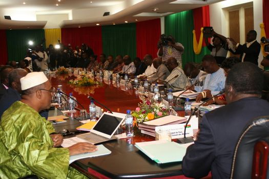 BURKINA FASO, Ouagadougou : Burkina Faso's interim president Michel Kafando and prime minister Isaac Zida take part in the first post-coup cabinet meeting, on September 25, 2015 in Ouagadougou. People rejoiced in Burkina Faso's capital on the eve, two days after the military restored power to a civilian regime, but uncertainty hung over the fate of the elite presidential guard that staged last week's coup.