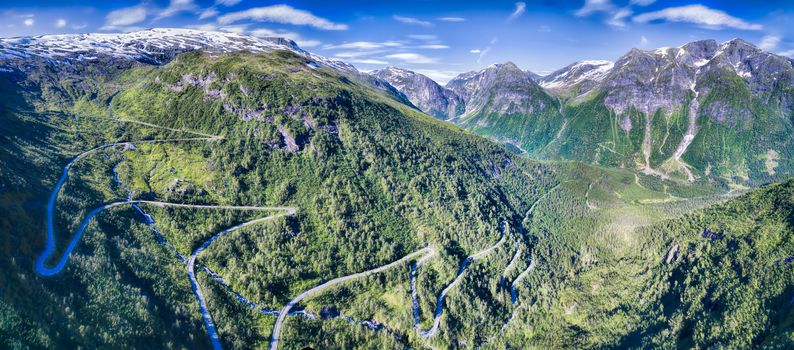 Mountain road in Gaularfjellet mountain pass in Norway surrounded by magnificient mountains