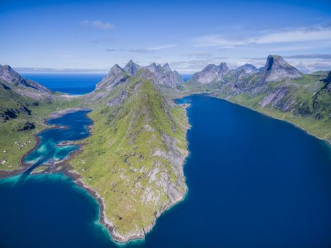 Reinefjorden, beautiful fjord on Lofoten islands in Norway surrounded by magnificient peaks