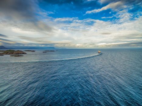 Aerial view of Hurtigruten leaving port on Lofoten islands