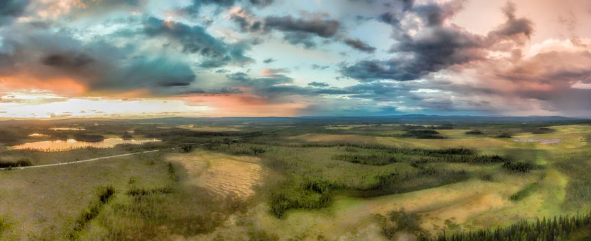 Aerial panorama of huge storm clouds forming over the forests in Sweden