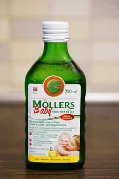 POZNAN, POLAND - SEPTEMBER 24, 2015: Moellers cod liver oil in a glass bottle