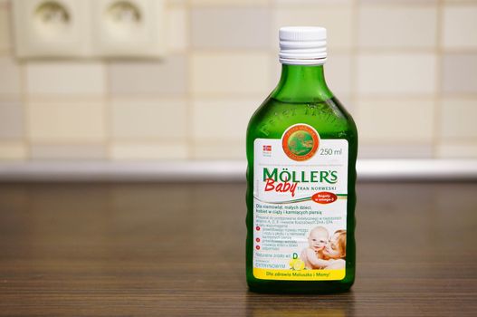 POZNAN, POLAND - SEPTEMBER 24, 2015: Moellers cod liver oil in a glass bottle