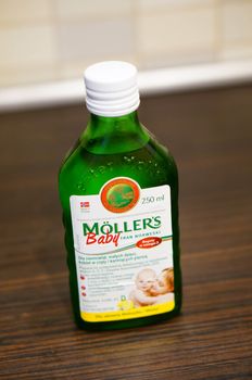 POZNAN, POLAND - SEPTEMBER 24, 2015: Moellers cod liver oil in a glass bottle