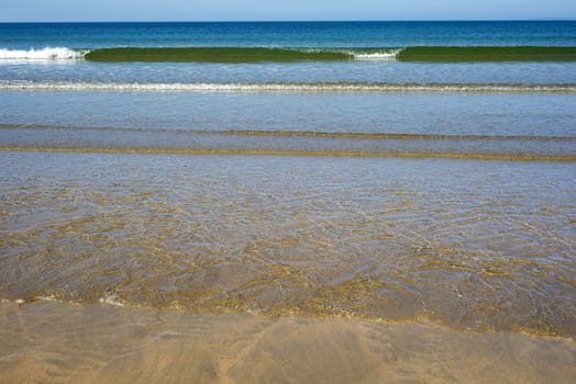 calm soft waves lashing onto ballybunion beach in county kerry ireland