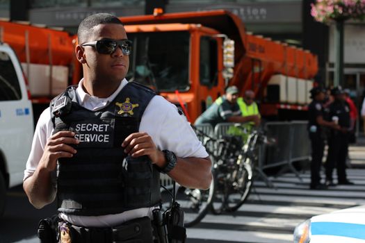 UNITED STATES, New York: A secret service agent stands guard near the United Nations headquarters in New York City ahead of the address by Pope Francis at the United Nations, September 25, 2015. 