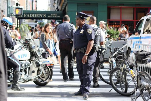 UNITED STATES, New York: A policeman stands guard near the United Nations headquarters in New York City ahead of the address by Pope Francis at the United Nations, September 25, 2015. 