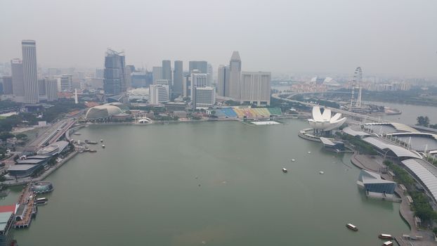 SINGAPORE: The terrible air pollution in Singapore known as the haze - caused by Indonesian forest fires and land clearances - continues on September 17, 2015, enveloping the CBD and Marina Bay. 