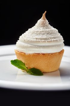 Beautiful cream Cupcake dessert on black background