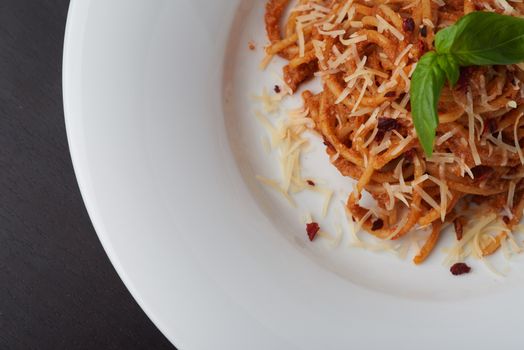 Spaghetti Bolognese with Basil Leaf and parmesan