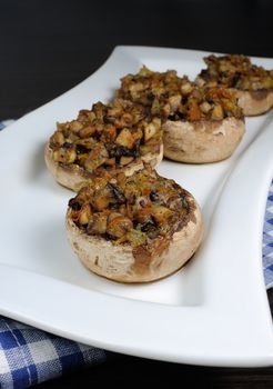 champignons with vegetable stuffing on a platter