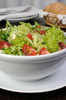 Light summer salad of lettuce with arugula and cherry tomatoes