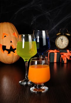 A variety of juices and drinks on the table in honor of Halloween