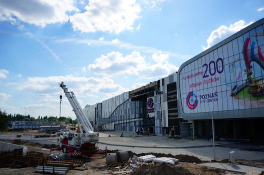 POZNAN, POLAND - AUGUST 25, 2013: Construction in front of the new shopping mall Poznan City Center