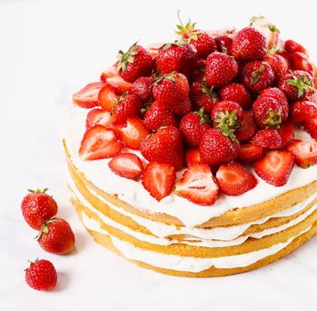 Layered, strawberry cake on the table