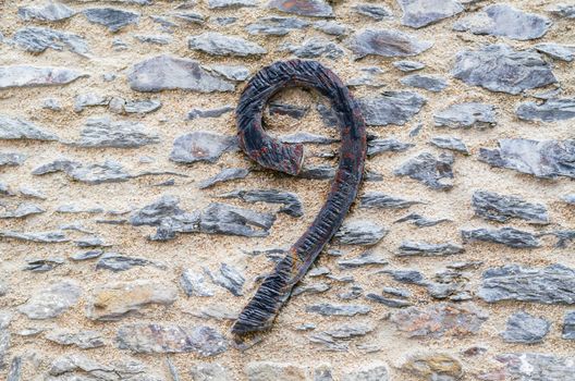 Old castle stone wall with speed Nr. 9 in wrought iron. texture background