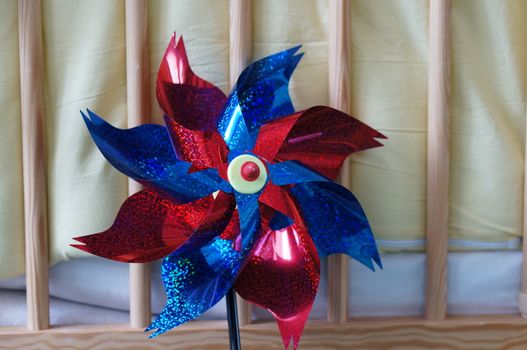 Turning plastic flower on stick