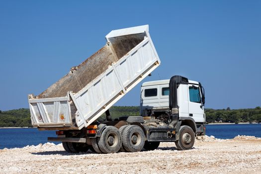 tipper truck after unloading crushed rocks