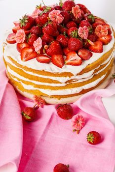 Layered, strawberry cake on the table