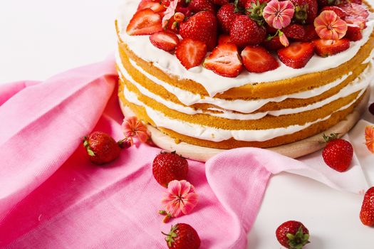 Layered, strawberry cake on the table