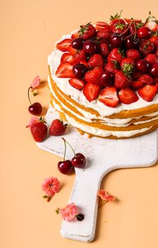 Layered, strawberry cake on the table