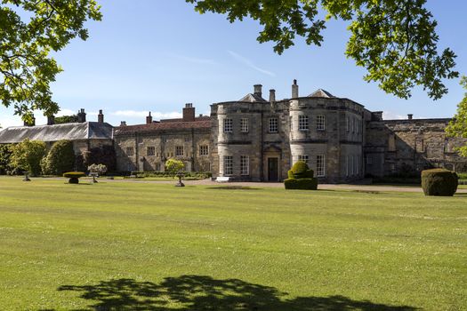 Newburgh Priory is a large country house near Coxwold, North Yorkshire, England. Standing on the site of an Augustinian priory, founded in 1145, it is a stately home in a rural setting with views to the Kilburn White Horse in the distance.