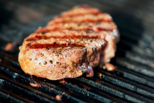 striped steak on a grill closeup