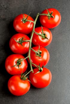 Tomatoes on dark table