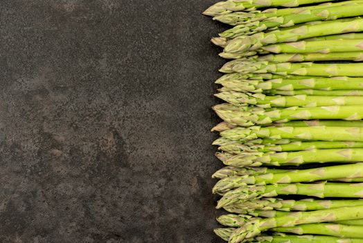 Asparagus on rustic table with copy space