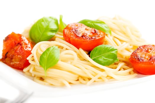 Traditional italian macaroni pasta with grilled tomato and oregano