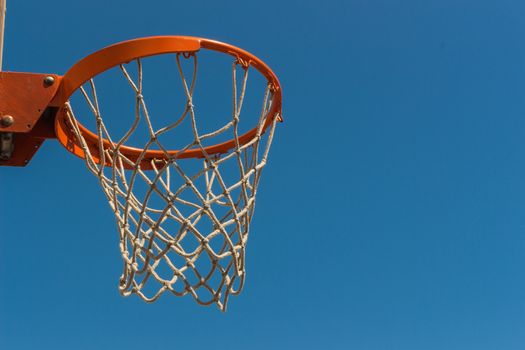 Baskeball hoop on a sunny day.