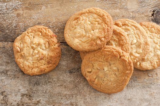 High Angle View of Fresh Baked Cookies Scattered on Rustic Wooden Background