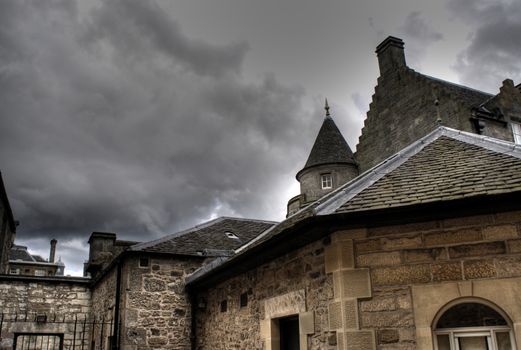 Edinburgh streets with dramatic sky tourists holiday in Scotland